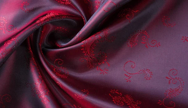 Текстура, ткань, красный шелк с рисунком из пейсли. Эта красивая p — стоковое фото