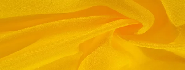 Padrão de fundo de textura, seda de tecido amarelo. Crepe de cetim o — Fotografia de Stock