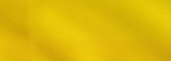 Patrón de fondo de textura, seda de tela amarilla. Crepe satén o — Foto de Stock