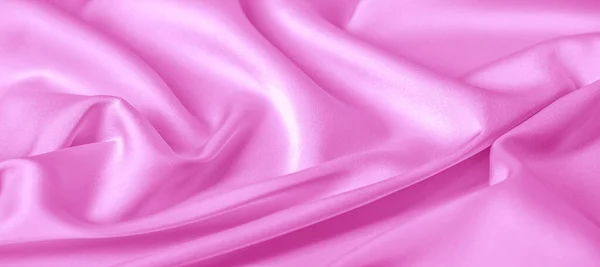 Consistenza. Tessuto di seta rosa. brillante lucentezza e caratteristica — Foto Stock