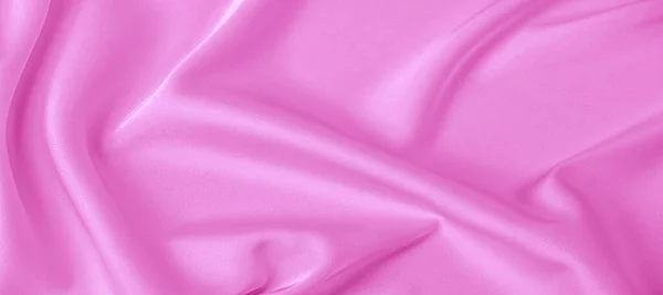 เนื้อสัมผัส ผ้าไหมสีชมพู ความมันวาวและลักษณะที่ยอดเยี่ยม — ภาพถ่ายสต็อก