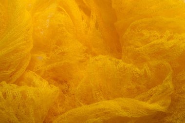 Doku arka planı, desen. Örgü sarı kumaş. Accen için ideal