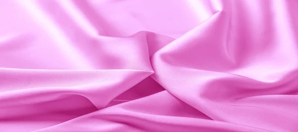 texture. Pink silk fabric. brilliant luster and characteristic