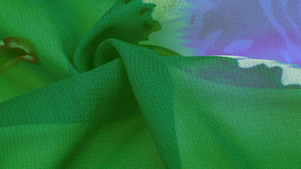 Textura, fondo, tejido de seda verde con un estampado floral azul . —  Fotos de Stock