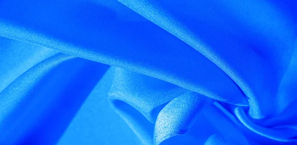 Textura, fundo, padrão, tecido de seda em azul. Esta seda é — Fotografia de Stock