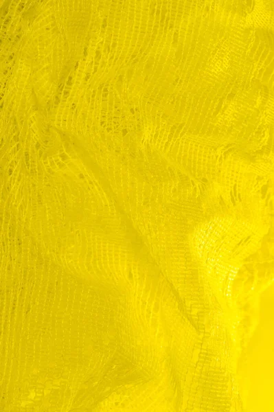 Textura, fundo, padrão. tule amarelo. Com um design simples — Fotografia de Stock