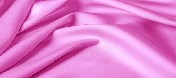 Textura. Tejido de seda rosa. brillo brillante y característica — Foto de Stock