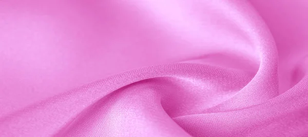 Tekstury. Różowa tkanina jedwabna. genialny połysk i charakterystyczny — Zdjęcie stockowe