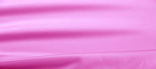 texture. Pink silk fabric. brilliant luster and characteristic