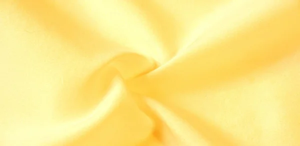 Текстура фону, візерунок. Шовкова жовта тканина. З Telio, Тхі — стокове фото