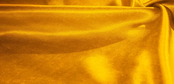 Textuur, achtergrond, patroon, zijde stof in geel. Dit adorab — Stockfoto