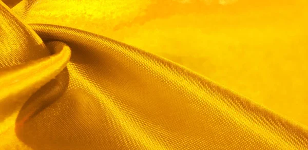 Textura, fundo, padrão, tecido de seda em amarelo. Este adorab — Fotografia de Stock
