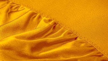 sarı doku ile bebek bezi. Bu çok yönlü kumaşın birçok kullanımı vardır,