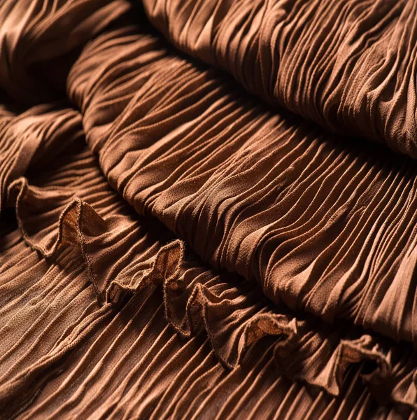 Textura, pozadí, vzorek, tkanina gofre hnědá. Meruňkové barvy. — Stock fotografie
