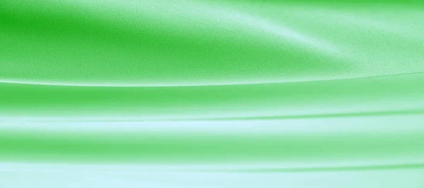 Taustan rakenne, kuvio. Vihreä smaragdi silkki kangas. Tämä on... — kuvapankkivalokuva
