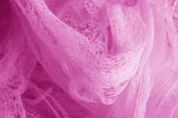 Fabric in a mesh of pink color. this is a micro-thin mesh, which