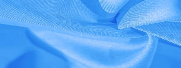Textur, bakgrund, mönster, solid ljusblå siden satin tyg — Stockfoto