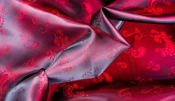 Texture, fabric, red silk with paisley pattern. This beautiful p