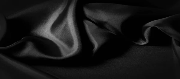 Textur, Hintergrund, Muster. schwarzer Seidenstoff. es ist schwarz und — Stockfoto