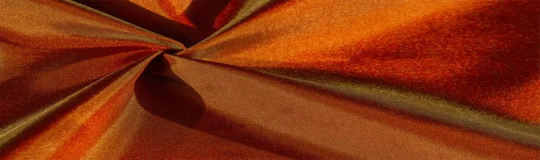Konsistens av vykort bakgrund, silke tyg från brunt till guld — Stockfoto
