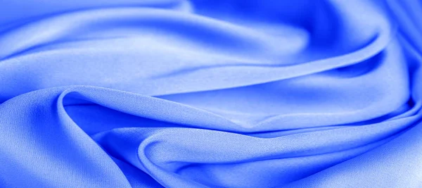 Texturu pozadí, vzorek. modrou hedvábnou tkaninu. Tento lehký — Stock fotografie