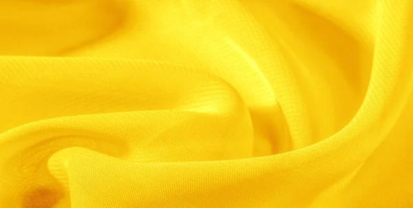 Textura fundo padrão amarelo tecido de seda. Este organza de seda — Fotografia de Stock