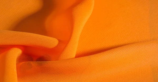 Fondo, patrón, textura, tela de seda naranja tiene un brillante — Foto de Stock