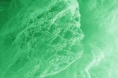 Örgü yeşilli kumaş. Sizin için ruhani parlaklık bir çizgi ekleyin