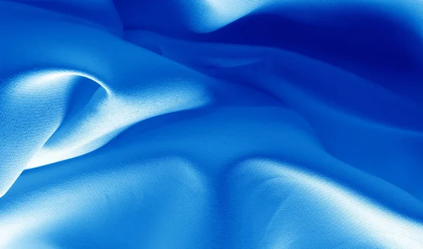 Una foto. Textura, fondo. Tela de seda de zafiro azul. Esta lu — Foto de Stock