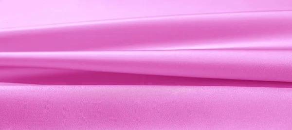 texture. Pink silk fabric. brilliant luster and characteristic