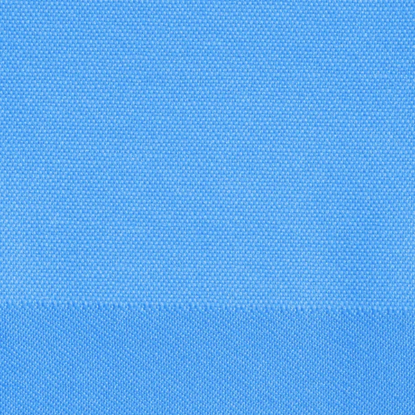 Текстура, фон, рисунок, твёрдая светло-голубая шелковая ткань — стоковое фото