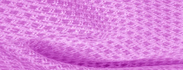 Textura pozadí, vzorek růžová tkanina s kovovými sekinkami. — Stock fotografie