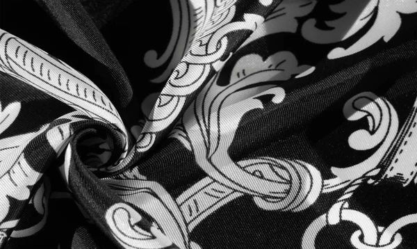 Текстура, фон, чорна шовкова тканина з візерунком монограми E — стокове фото
