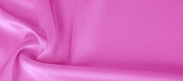 texture. Pink silk fabric. brilliant luster and characteristic