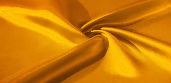 Textura, fundo, padrão, tecido de seda em amarelo. Este adorab — Fotografia de Stock