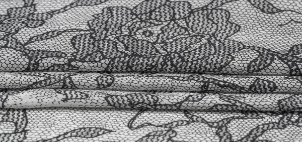 Tekstura, tło, wzór. Jedwabna biała tkanina z koronkowym patterem — Zdjęcie stockowe