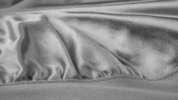 Patterned fabric with gray texture. This versatile fabric has ma — Stock Photo, Image