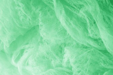 Örgü yeşilli kumaş. Sizin için ruhani parlaklık bir çizgi ekleyin