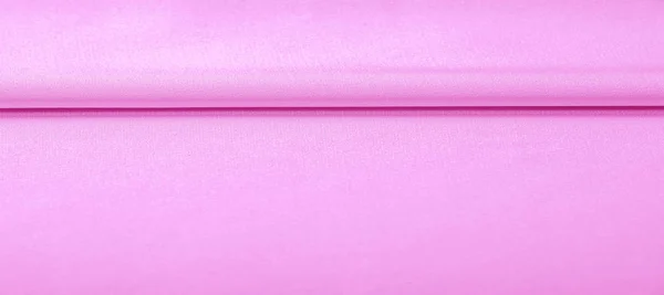 Textur. rosa Seidenstoff. brillanter Glanz und charakteristisch — Stockfoto