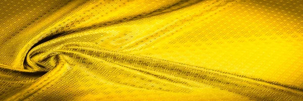 Background texture, pattern. Yellow, mustard silk fabric with a — Stock Photo, Image