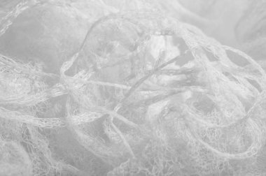 Bir un sayesinde bir örgü doku arka plan deseni beyaz kumaş