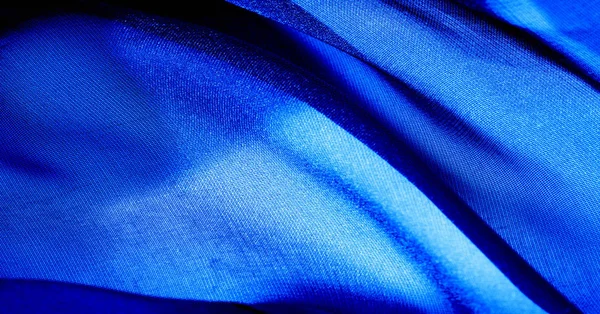 Background, pattern, texture, wallpaper, blue silk fabric. Add a