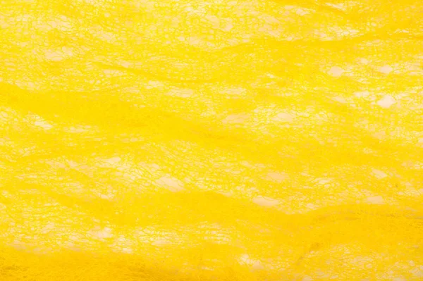 Texture background, pattern. Mesh yellow fabric. Ideal for accen