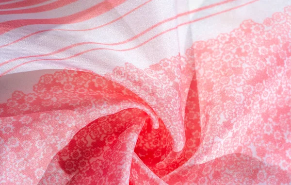 Текстура, фон, узор, розовая шелковая ткань на белом фоне — стоковое фото