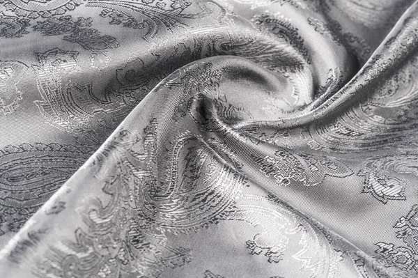 Textura, fundo, tecido cinza de aço preto com um patt paisley — Fotografia de Stock