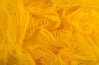 Doku arka planı, desen. Örgü sarı kumaş. Accen için ideal