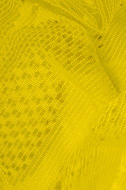 Doku, arka plan, desen. sarı tül. Basit bir tasarıma sahip