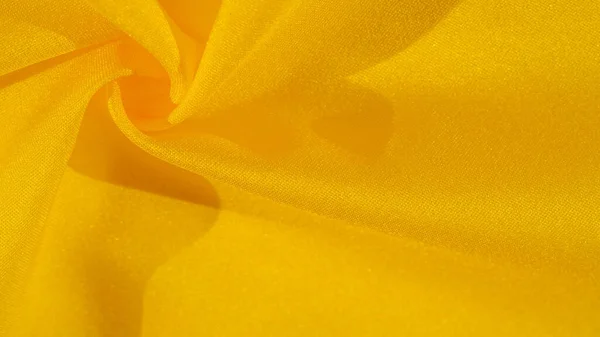 Pola latar belakang tekstur, sutra dari kain kuning. Crepe satin o — Stok Foto