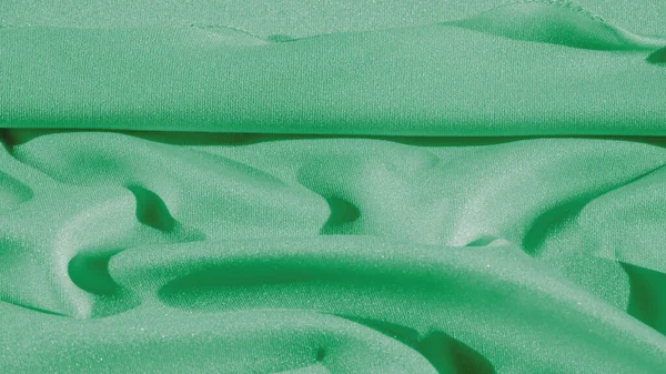 Textura, fundo, tecido de seda, xale de mulher verde Conveniente — Fotografia de Stock