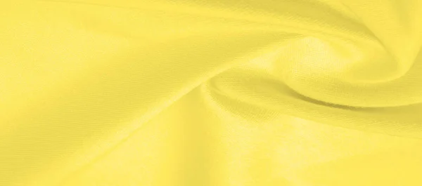 Texture background pattern. Knitted fabric Yellow. Stinging, xan